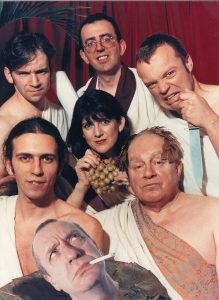 Loose Ends cast dress in Roman togas. Ned has a laurel on his head. Emma holding a bunch of grapes. Arthur's hea is superimposed at the front.