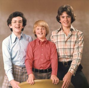 Photo of Richard and his two brothers. Very 70s looking, a lot of check trousers and shirts going on in this pic