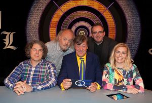 Press shot of the Qi cast. Alan Davies, Bill Bailey, Stephen Fry, Richard Coles, Sarah Pascoe